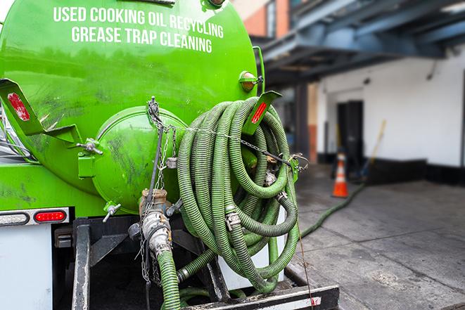 pump truck removing waste from a grease trap in Baldwin Park